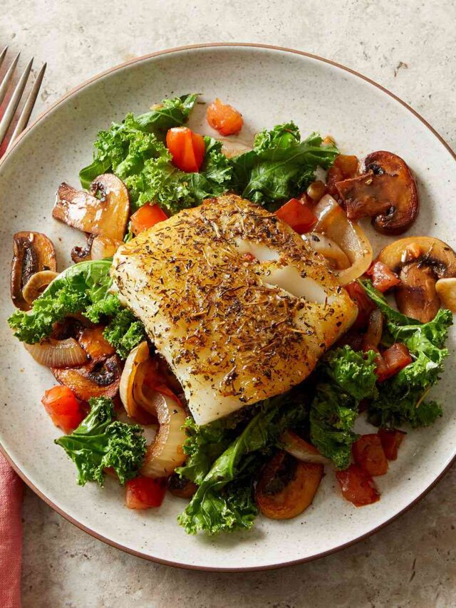 Herby-Mediterranean-Fish-with-Wilted-Greens-MUshrooms-d76ab7b6a00e4fefbc12748a94593df3 dfhtn